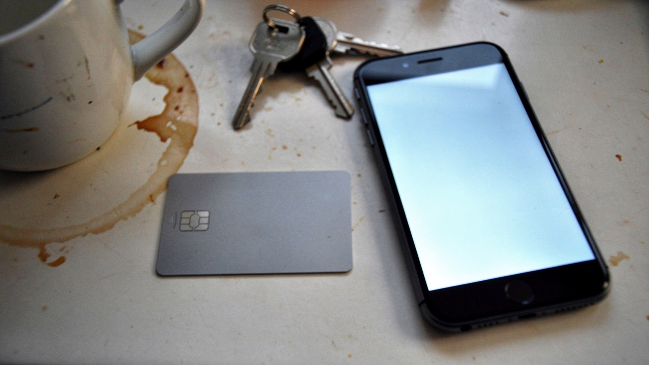 Bank card and phone on a kitchen counter